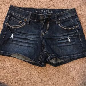 Distressed denim shorts